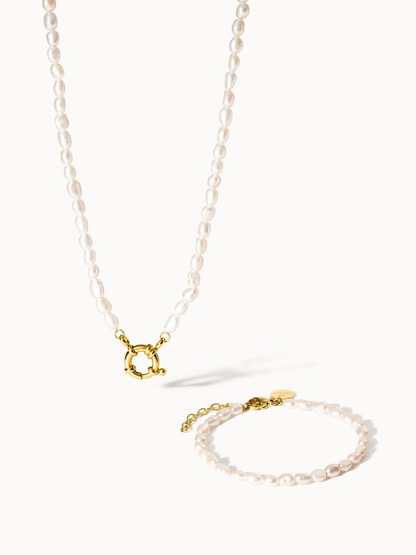 Perlenkette und Armband in zartem Rosa mit goldenen Akzenten von PURELEI.